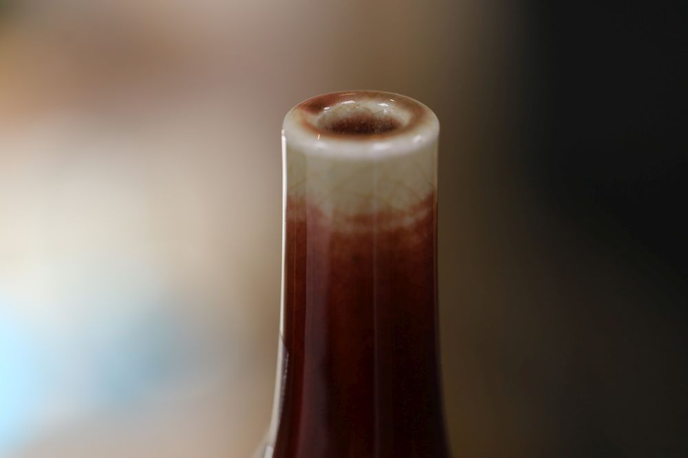 A Chinese sang de boeuf glazed langyao bottle vase, late 19th / early 20th century, H.19cm